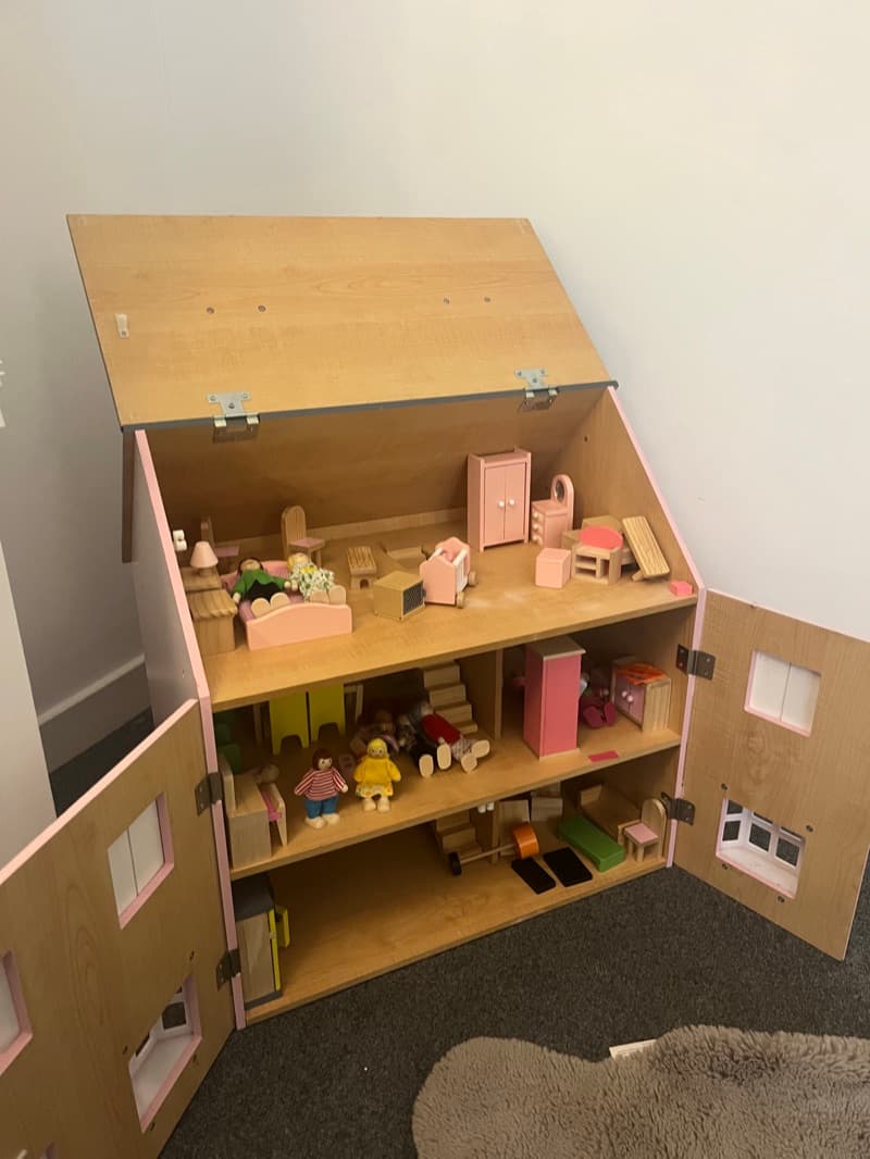 Doll house with figures for play-based therapy